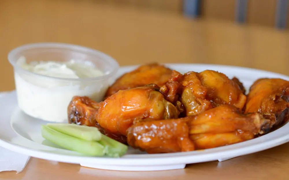 Buffalo chicken wings with celery and blue cheese