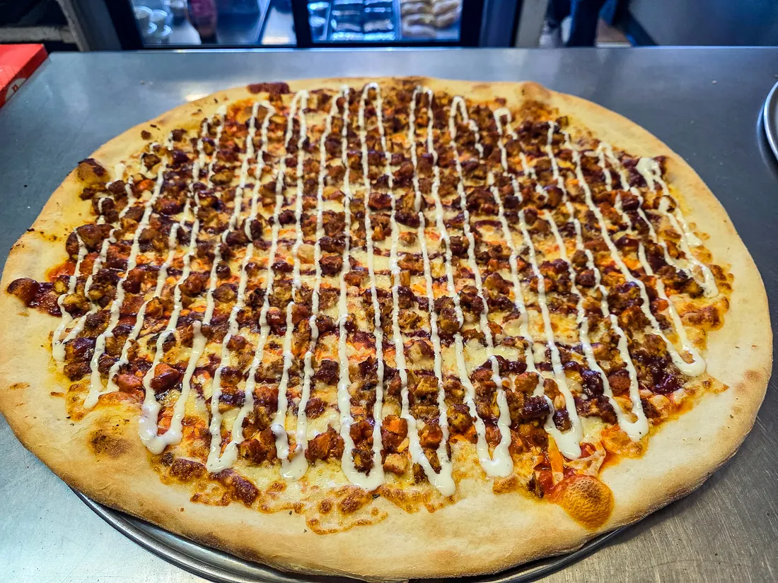 A chicken pie finished with a ranch drizzle
