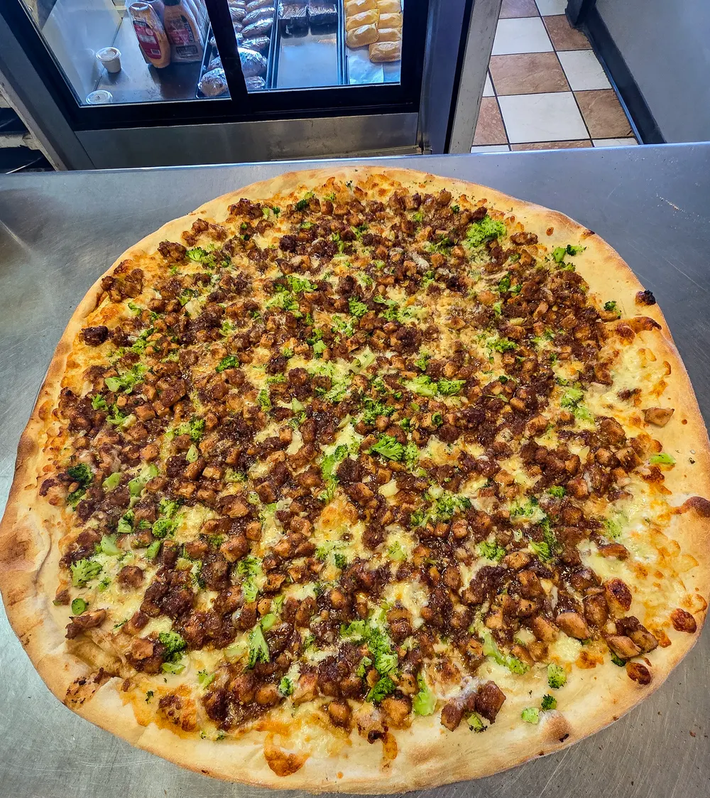 A chicken and broccoli specialty pie